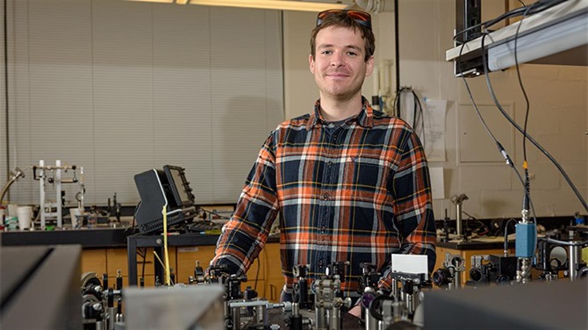 Doctoral student Baxter Abraham, seen here in the laboratory of his mentor, UD physicist Lars Gundlach, has won a Department of 